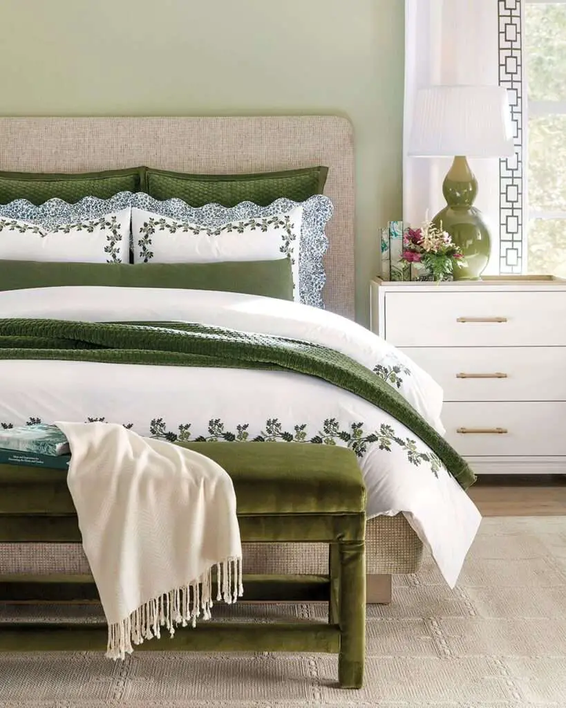 Cozy bedroom idea in green color palette using velvet bedding and accent