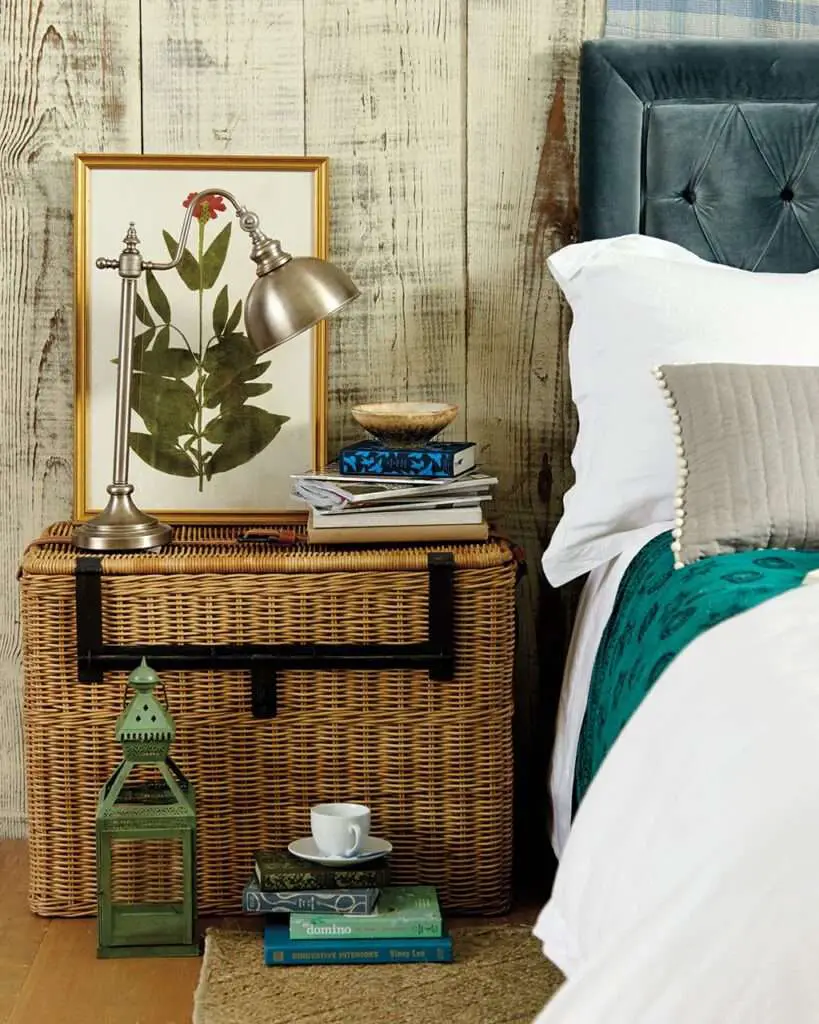 Use a large wicker basket next to a bed in place of a nightstand